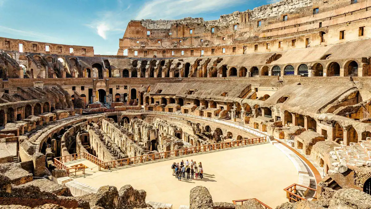 Brick corridors of the Colosseum hypogeum viewed from the arena floor on a Rome underground tour